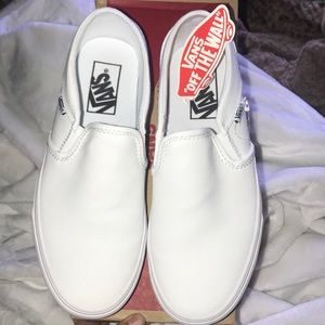 All white slip on vans